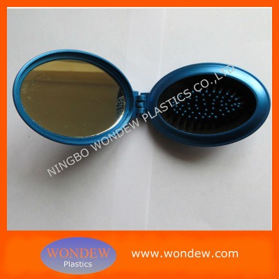 Oval hairbrush mirror